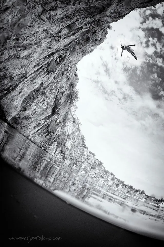 Figure in flight at a cave opening